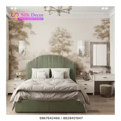 In this bedroom, the custom furniture and wallpaper work together to create a cohesive theme. The muted, scenic wallpaper provides a soft, artistic background that enhances the elegance of the green upholstered bed.
