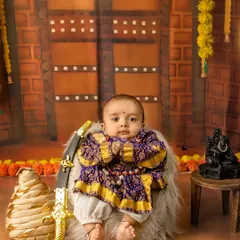 A tribute to our heritage with a Chhatrapati Shivaji Maharaj themed session. It fills me with pride to create these powerful portraits, complete with traditional attire and props like the tiny sword and turban, connecting the youngest generation to our history.