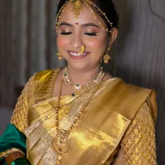 That happy bridal glow. The soft, shimmery eye makeup and neutral tones brought out Dhanashree's joy on her big day.