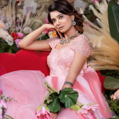 Another view of the pink ball gown, perfect for a romantic, floral-themed photoshoot.
