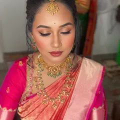 The makeup looks flawless from every angle, enhancing her natural beauty without feeling heavy.