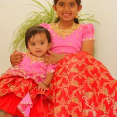 A closer look at these adorable sisters in their matching red and pink ethnic outfits. I design these sets to be comfortable for all ages, from infants to older children.