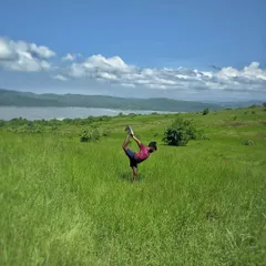 Practicing Natarajasana (Dancer's Pose) in a field in Gokarna. For me, setting a stage for practice is like worshipping the body, finding beauty in the movement and the surroundings.