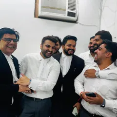 Sharing a laugh with my colleagues. A strong, positive team environment is essential for handling the pressures of our profession.