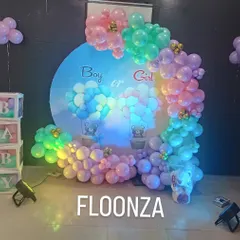 Here you can see the gender reveal setup with spotlights that enhance the colors of the balloon garland. The illuminated "BABY" blocks on the side add another layer of charm and provide a warm glow to the entire scene.