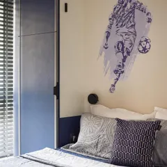 For the football lover, we added a custom wall decal. It's a simple but effective way to personalize the space and reflect the child's interests.
