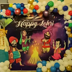 For a vibrant Lohri celebration, I used a custom-printed backdrop with traditional Punjabi folk characters. The scene is framed by a multi-colored balloon arch that adds to the festive and joyful atmosphere of the event.