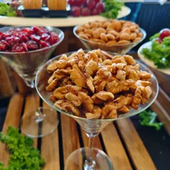 Healthy and elegant snack options like walnuts, almonds, and cranberries, beautifully presented in martini glasses for the Bombay Gymkhana celebration.