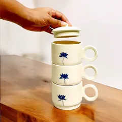 These stackable, hand-painted ceramic cups with a delicate blue lotus motif are perfect for sharing a cup of tea. I am currently accepting pre-orders for these unique sets.