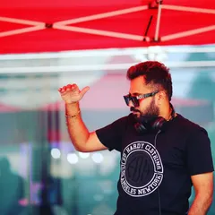 A candid shot of me signaling to the sound engineer during an outdoor set. It shows the coordination and professionalism that goes into ensuring perfect audio quality for any event.