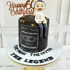A cake for "The Man, The Myth, The Legend." This Jack Daniel's inspired cake was for a 60th birthday, featuring a "Aged to Perfection" label and a custom fondant figure of the man of the hour.