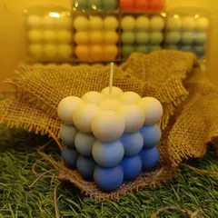 This is my triple-color ombre bubble candle, a modern sculptural piece that adds a pop of color to any room. Each one is hand-poured to create this unique gradient effect.