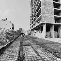 This on-site photograph shows the rebar framework for a new floor slab at the JP Nagar project. It is a glimpse into the critical engineering and structural work that forms the foundation of every building I design, a process where precision is paramount.