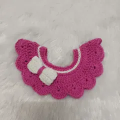 Here is the same scalloped collar design in a vibrant pink. You can pair it with a simple t-shirt to dress up an outfit or even sew it on for a permanent, adorable look.