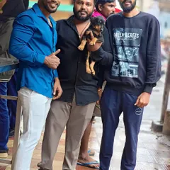 Me with two happy customers who just got their new Rottweiler puppy. I always ensure my customers are satisfied.