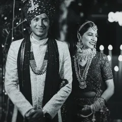 A happy, candid black and white portrait of the wedding couple. This style strips away distractions and focuses on their joyful connection.