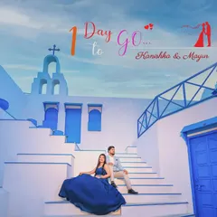 A stunning pre-wedding shoot in a Santorini-themed location, used for a "1 Day to Go" wedding countdown.
