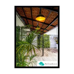 I designed this covered patio to be a true outdoor room. The wooden deck, comfortable seating, and warm overhead lighting are complemented by a vertical garden, bringing the feeling of nature into a protected space.