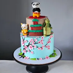 This Kung Fu Panda cake was a fun challenge, featuring Po, Master Shifu, and Master Oogway. The design includes a tier with beautiful, hand-painted cherry blossoms, all on a whipped cream cake.