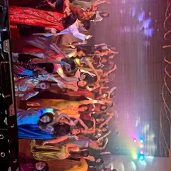 A fantastic group photo on the dance floor. This was at a vibrant sangeet night where everyone was in high spirits.