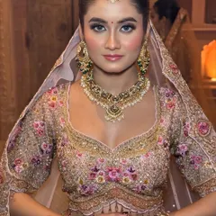 My philosophy is "less makeup, more you". For this bride's pastel lehenga, I created a soft glam look with a dewy finish, rosy cheeks, and natural-looking makeup that enhances her features without feeling heavy.
