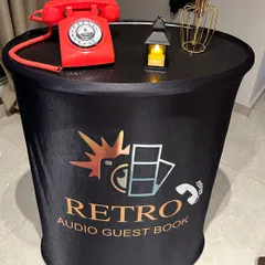 My podium setup is a simple and stylish way to capture memories. It includes a classic retro phone on a branded stand, making it a compact option that fits perfectly into any event space.
