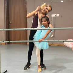 The bond between teacher and student is built on trust and encouragement. These photos capture the hands on, personal guidance our instructors provide to help every dancer grow.