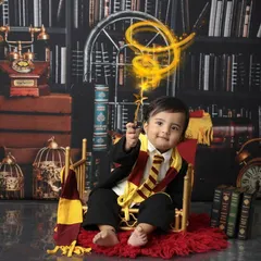 Wingardium Leviosa! With a flick of his wand, this tiny wizard casts a spell of cuteness. I use special effects in post-production to add a touch of magic to themed photoshoots like this Harry Potter session.
