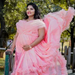 A beautiful example of a soft pink ruffled gown. The layers of tulle add texture and movement, creating a romantic and dreamy look for this solo portrait.