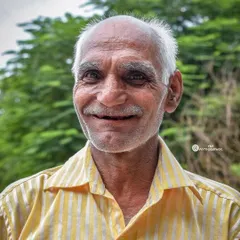 After a few moments, his serious expression broke into this wonderful, genuine smile. It completely changed the feel of the portrait and shows the importance of connecting with the people I photograph.