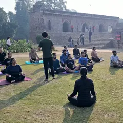 Leading a community yoga session. As Mahatma Gandhi said, our habits become our values, and our values become our destiny. Let's build positive habits together.
