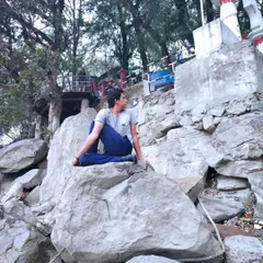 Here I am practicing a seated spinal twist on a rock formation. Twisting asanas are essential for maintaining spinal health, as they massage the internal organs and increase flexibility in the back muscles.