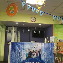 Welcome to a winter wonderland! For Elisa's birthday, we transformed our reception area with a "Frozen" theme, complete with banners and icy decorations.