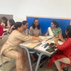 Teachers at DPS Hinjawadi fully immersed in a collaborative task. These activities are designed to model the kind of engaged, hands-on learning we want to create for students.