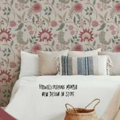 A bedroom featuring a beautiful floral vine pattern wallpaper. The soft colors and classic design create a romantic and restful atmosphere.