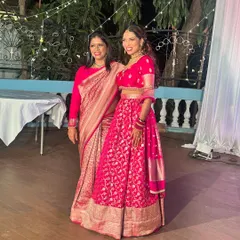 A beautiful moment with my daughter Jothi, both of us in our festive pinks. I'm wearing a classic Banarasi saree, and she is in a custom lehenga. Moments like these are what my brand is all about: family, celebration, and grace.