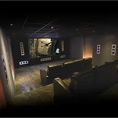 This perspective highlights the layout of a professional-grade viewing room we designed. The precise placement of front and surround speakers, combined with the tiered seating arrangement, guarantees that every seat in the house is the "sweet spot" for both audio and video.