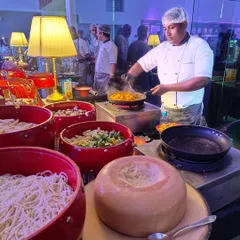 An interactive live pasta station in action at the futuristic Mercedes EQ launch. Guests enjoyed fresh pasta tossed in a wheel of Parmesan cheese, offering a theatrical and delicious element that makes any event more engaging and memorable.