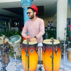 A daytime pool party setup in Kochi. I'm on the congas and darbuka, ready to play alongside a DJ to create the perfect sundowner vibe for a wedding event.