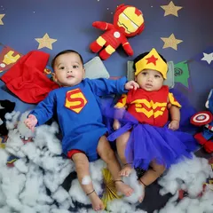 Double the fun with a superhero-themed twin photoshoot. I love creating dynamic scenes like this one with Superman and Wonder Woman, showcasing their unique bond from day one.
