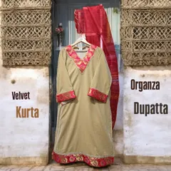 Ethnic simplicity at its finest. This beige velvet kurta features a beautiful pink embroidered border and is paired with a lightweight organza dupatta for a graceful look.