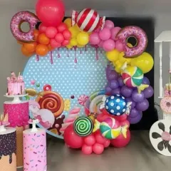 A sweet and colorful Candyland theme, bursting with fun. This decoration includes a custom backdrop, vibrant balloon arrangements, and oversized donut and candy props to create a playful atmosphere.