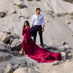 The impressive train of the fishtail gown, showcasing how it adds drama and movement to pre-wedding photos in this beautiful outdoor setting.