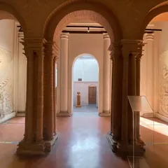 The arched hallway of the Sister Nivedita Museum, where restored brickwork and new bas-relief panels coexist. Our restoration philosophy involves a careful dialogue between the old and the new, respecting the building's original character.