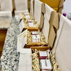 A closer look at our custom plastic-free gift sets. The natural shredded paper provides beautiful and eco-friendly cushioning for the products inside.