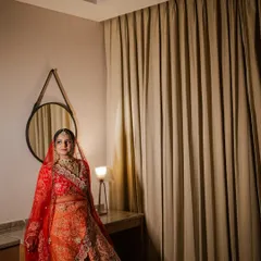 A stunning bridal portrait of Saloni on her wedding day. I captured her in a quiet moment of reflection, the soft lighting highlighting her elegant attire and calm demeanor.