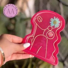 This premium resin trinket tray in a vibrant pink is perfect for organizing your bedside table or office desk in style.