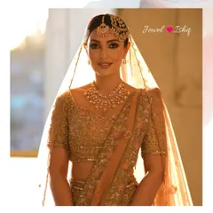 A sun-kissed portrait of the bride in a beautiful pastel and gold lehenga. The uncut diamond polki jewellery adds a warm, radiant glow to her look.