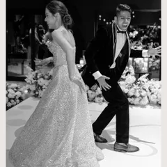 Let the party begin! This fun, high-energy black and white shot captures the couple's playful personalities as they hit the dance floor.
