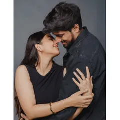 A timeless studio portrait that focuses purely on the couple's connection. Dressed in classic black, their embrace and smiles speak of a love that is both elegant and deeply felt.